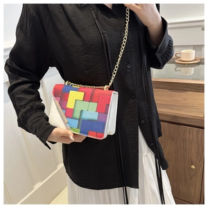 Crossbody square bag featuring colorful geometric patchwork and gold chain strap