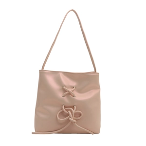 Pink minimalist tote bag with bow detail and metal eyelets on white background