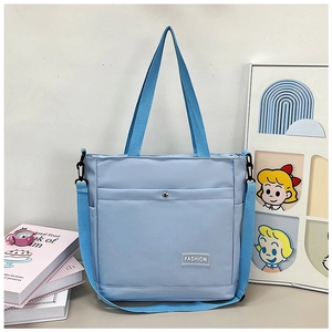 Sac cabas en toile bleu clair à grande capacité avec bandoulière réglable et étiquette