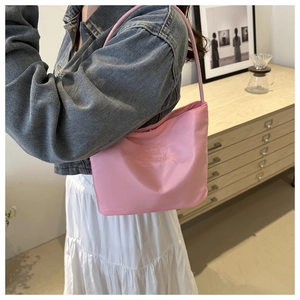Detailed pink nylon shoulder bag with onwards and upwards letter embroidery for daily commute