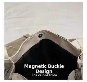 Detail shot of the magnetic button closure and interior lining of the canvas tote bag