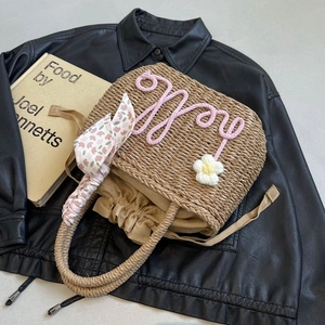 Handmade woven straw handbag with pink Hello embroidery and daisy flower for summer beach