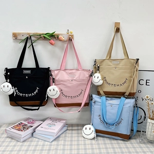 Grande borsa shopper in tela per studentesse in quattro colori con tracolla regolabile