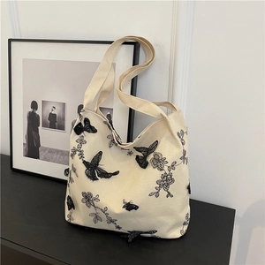 Chic canvas tote bag with black lace butterfly embroidery and long shoulder straps