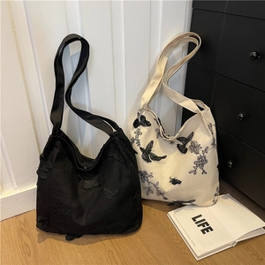Embroidered butterfly tote bag in black and cream white with 3D lace details