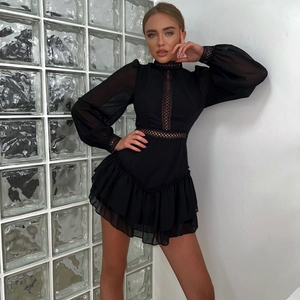 Elegant black long-sleeved chiffon dress with lace cutout details and tiered ruffle hem