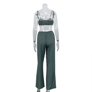 Detail view of the elastic pleated back on striped crop top and high-waist pants set