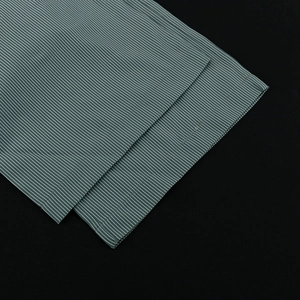 Detailed close-up showing the fine blue and white striped fabric texture and neat stitching