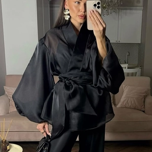 French style sheer black wrap top with puff sleeves and oversized waist bow detail