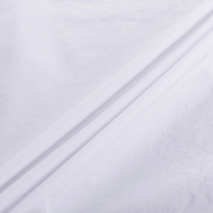 Détail de la texture du tissu en coton blanc doux pour chemise femme avec armure naturelle