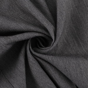Gros plan détaillé du tissu tissé mélangé gris foncé pour pantalon large élégant