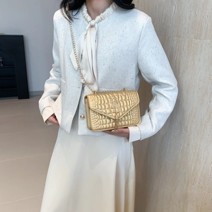 Fashionable gold stone texture crossbody bag with S logo and metallic chain strap