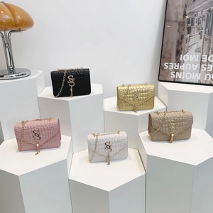 Chic stone pattern crossbody chain bags for women in multiple colors on a display
