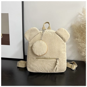 Detail of beige corduroy backpack with 3D bear ears and a matching mini hanging pouch