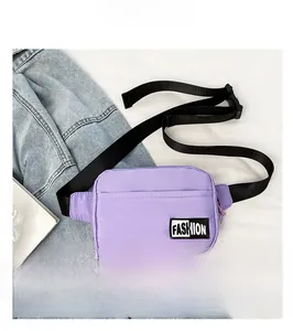 Detail of purple nylon crossbody bag with Fashion patch on white bedding scene