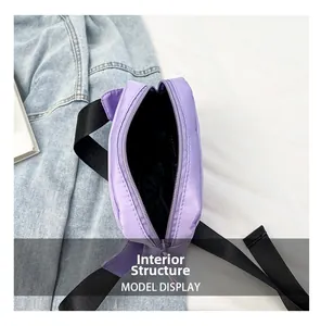 Internal structure of purple nylon crossbody bag with dark waterproof lining and zipper