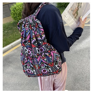 Detail of colorful geometric print canvas bag with drawstring and ethnic pattern design