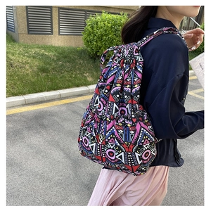 Detail of ethnic geometric pattern on large canvas drawstring backpack for women