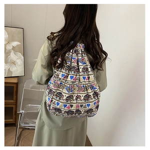 Detail view of Bohemian canvas drawstring backpack with ethnic elephant and heart patterns
