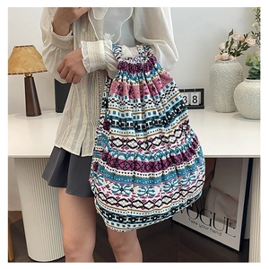 Detailed shot of large geometric ethnic pattern canvas bucket bag with drawstring
