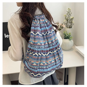 Close-up of ethnic geometric pattern canvas backpack with drawstring closure details
