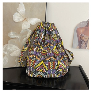 Detail of tribal pattern canvas backpack featuring a drawstring closure and side pockets