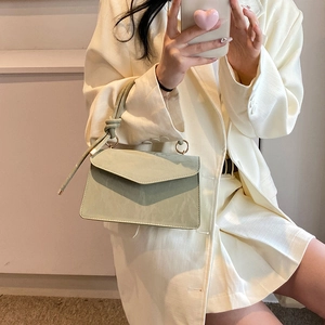 Minimalist light green leather square crossbody bag with V-shaped flap and knot handle