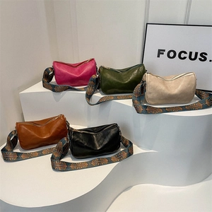 Minimalist soft PU leather crossbody pillow bags with colorful ethnic woven straps in 5 colors