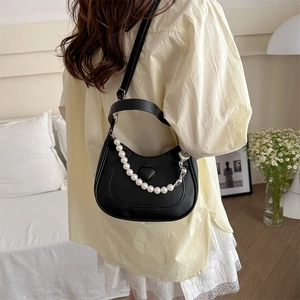 Black crescent moon bag with heart embossing and decorative white pearl chain