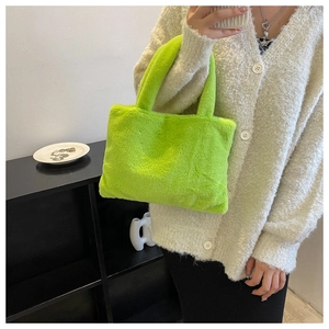 Detail shot of neon green fuzzy tote bag with soft plush texture and matching dual handles