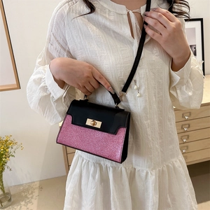 Fashionable pink glitter and black leather crossbody bag with golden metal lock
