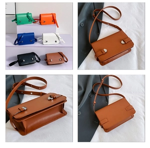 Dettaglio di borse a tracolla vintage in ecopelle marrone, nera, verde e arancione per donna