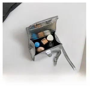 Silver mini bag interior capacity view with shiny pleated metallic foil material texture
