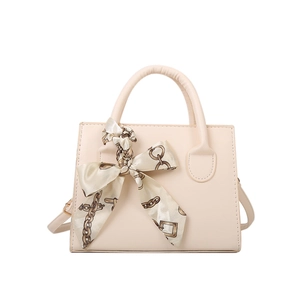 Chic beige square handbag with decorative silk scarf and gold chain for women
