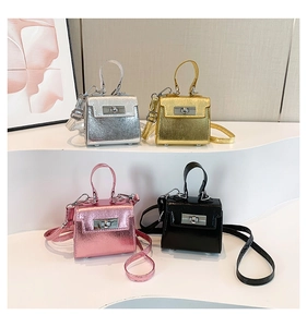 Micro-sized trapezoid handbags with metal twist locks in metallic and patent finishes