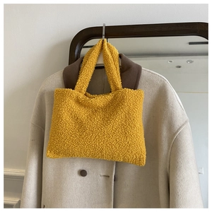 Minimalist ginger yellow plush tote bag with soft fleece texture for autumn style