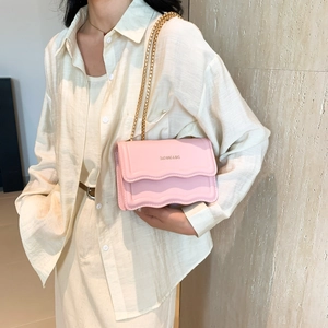 Chic pink leather crossbody square bag with wavy flap design and gold chain strap