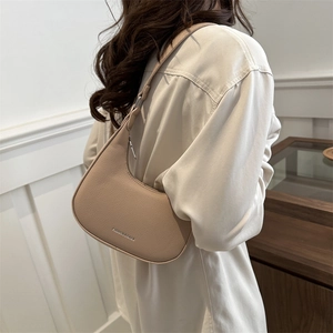 Chic beige crescent armpit bag in lychee pattern leather with fashion text logo