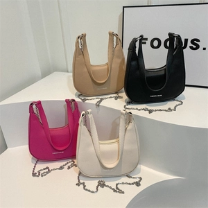 Minimalist hobo underarm bags in black, khaki, and cream leather with metal chain straps