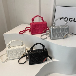 Minimalist geometric quilted handbags in magenta, silver, cream, and black colors