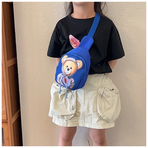 Detailed view of kids blue crossbody bag with teddy bear print on adjustable strap