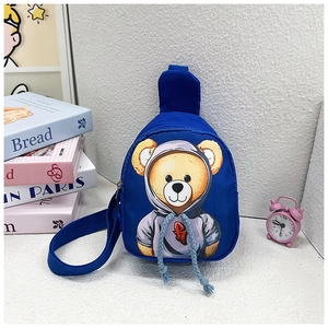 Close-up of royal blue kids fanny pack with cute cartoon bear print and adjustable strap