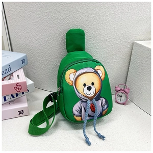 Detail of green nylon kids crossbody bag with cute bear print and adjustable strap