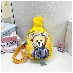 Detail of yellow kids fanny pack with cartoon bear print and blue drawstring accents