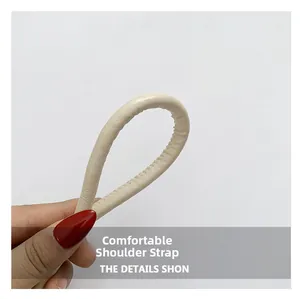 Close-up of comfortable cream leather shoulder strap showing premium stitching details
