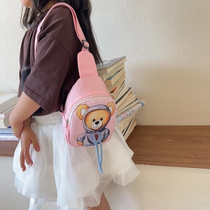 Pink cartoon bear chest bag for kids with adjustable strap shown in a lifestyle setting