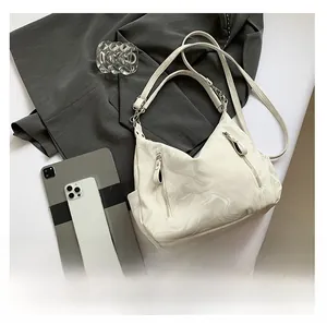 Detailed macro of marble texture handbag with double zipper pockets and dual straps