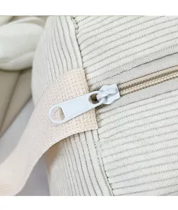 Macro detail of glossy hardware zipper head on corduroy large capacity shoulder bag