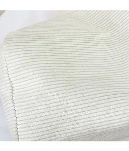 Detail of creamy white ribbed fabric texture on lightweight shoulder pillow bag