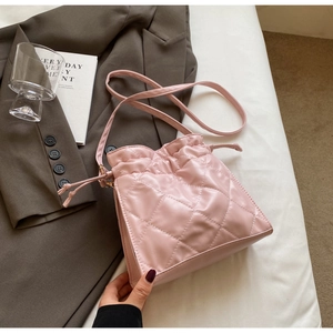 Pink quilted PU leather bucket bag with drawstring closure and shoulder strap for women